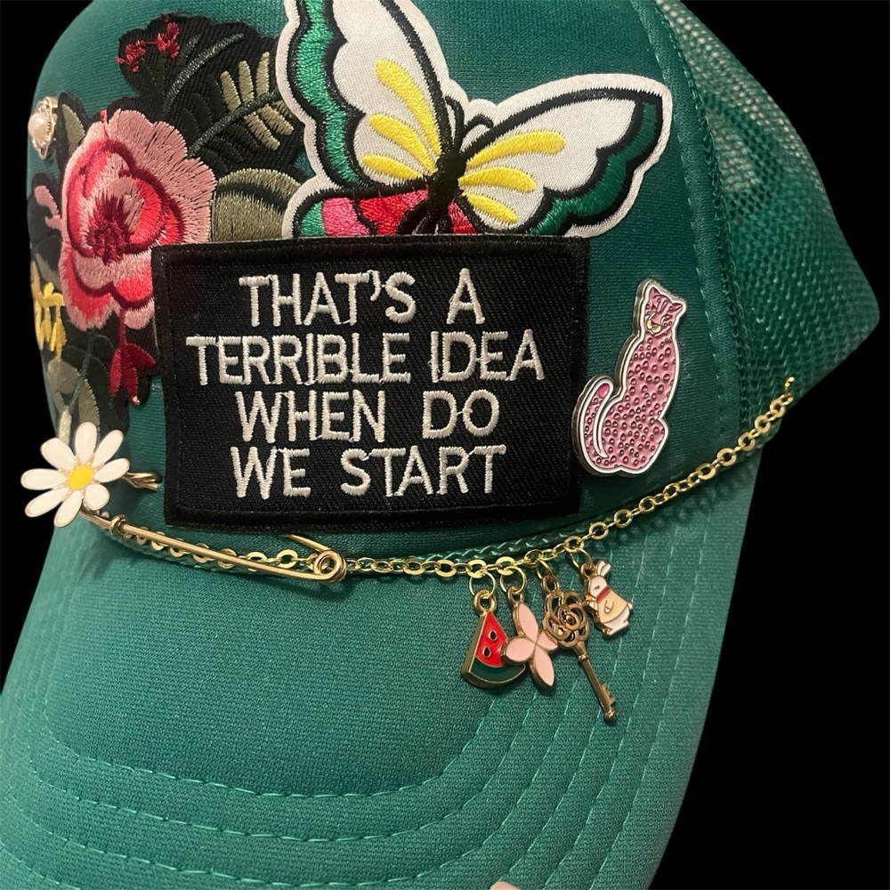 Green Cap with Floral and Butterfly Accents